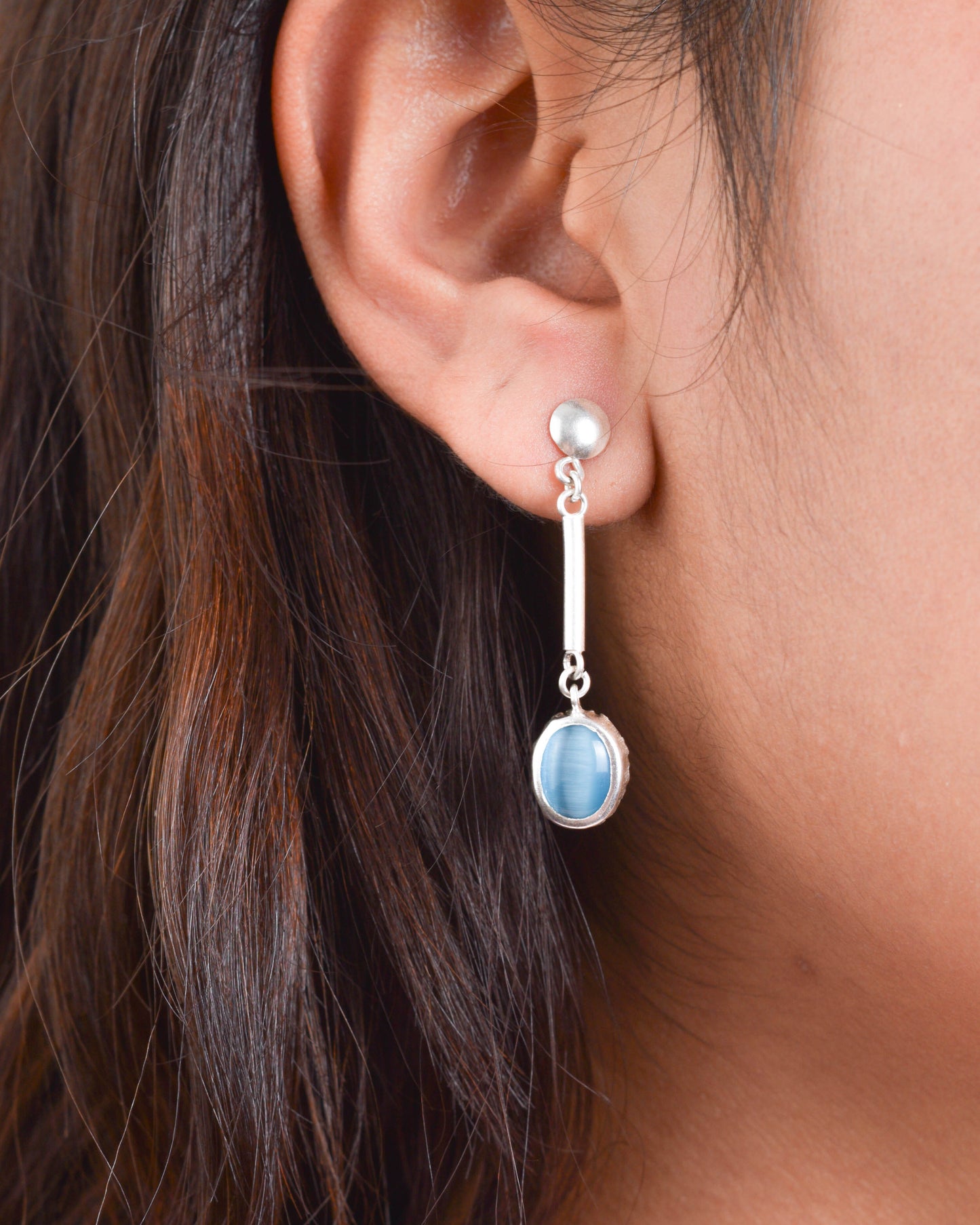 Juego ojo de gato celeste circular - Plata