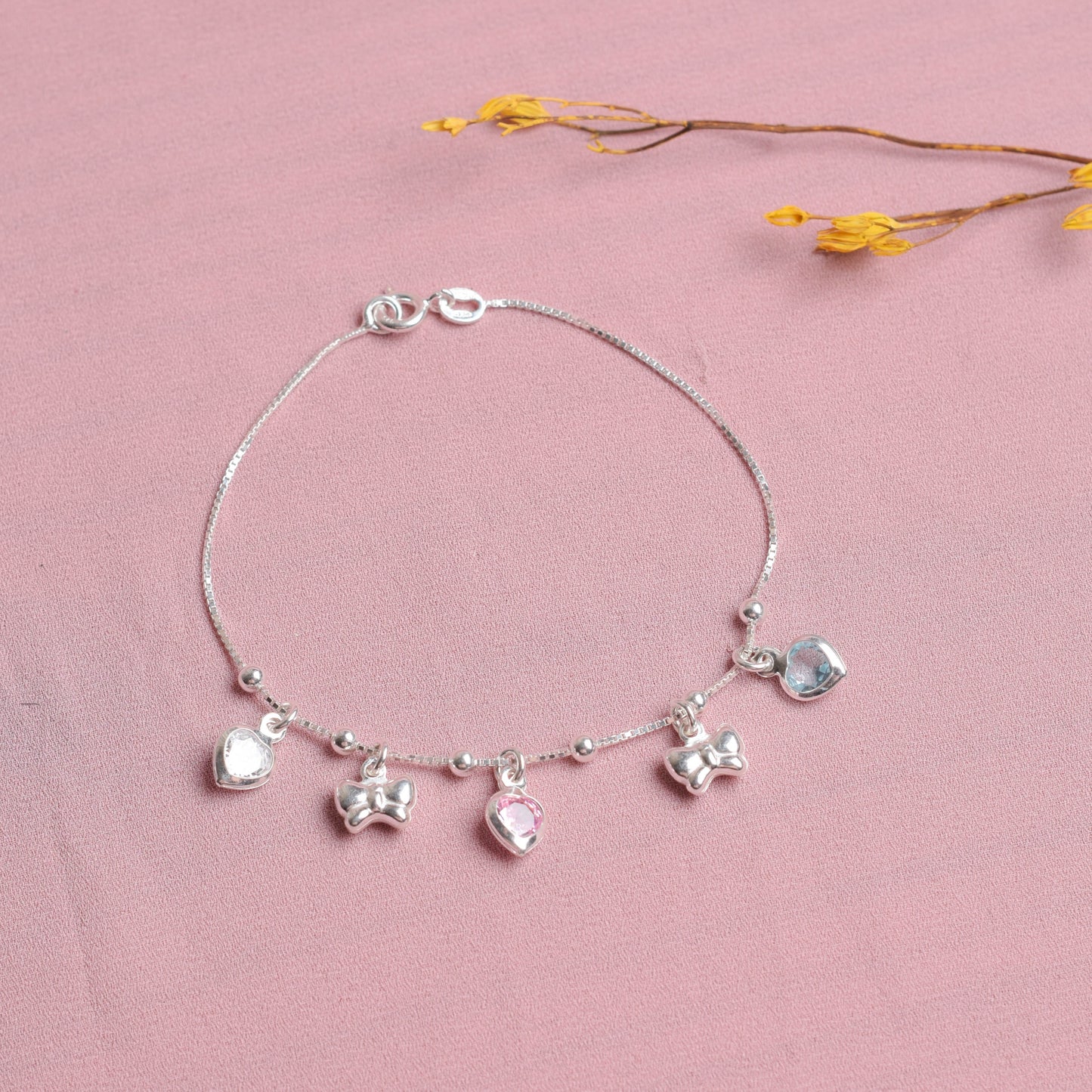 Pulsera dijes moños - Plata