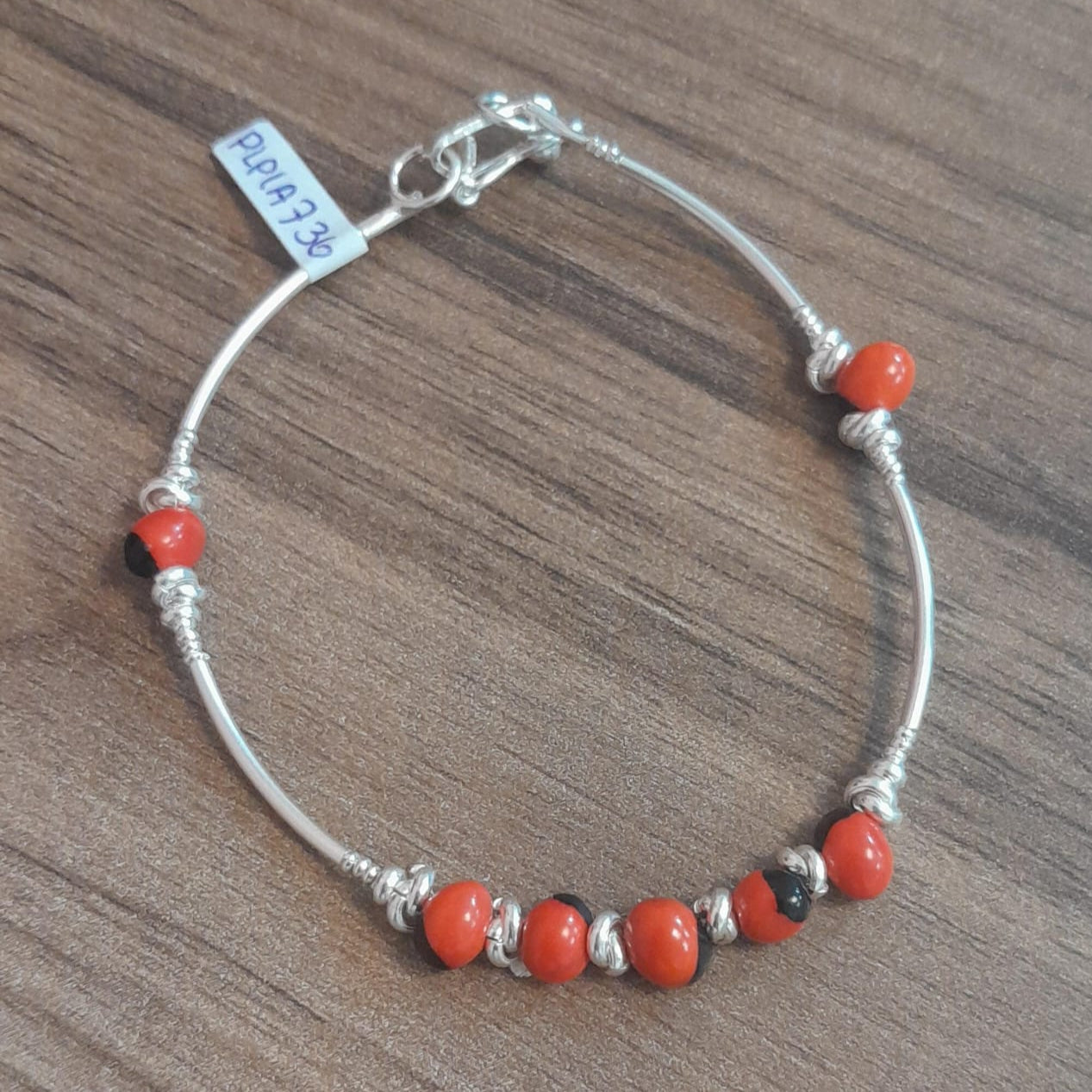 Pulsera huayruro, tubo y nudos - Plata