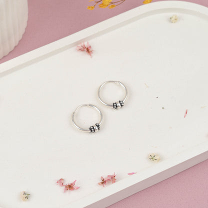 Argolla esfera con donas enrolladas - Plata quemada