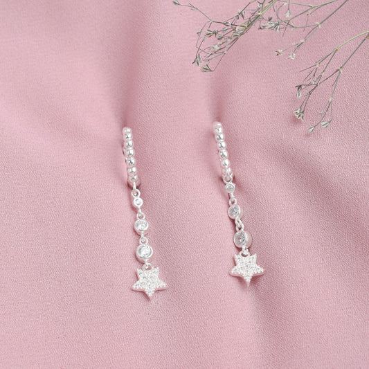 Argolla huggies estrella colgada  - Plata