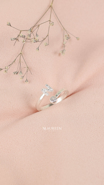 Anillo ajustable letras con punto de luz - Plata
