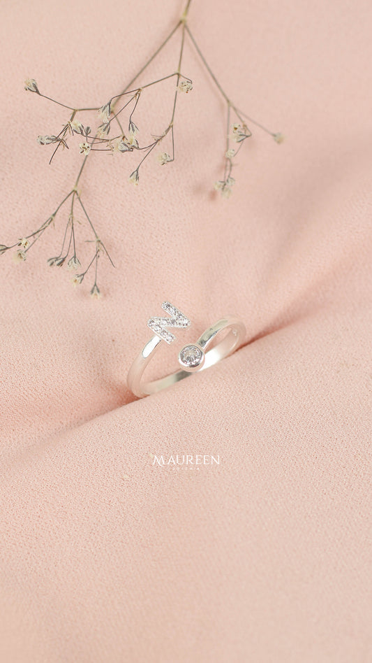 Anillo ajustable letras con punto de luz - Plata