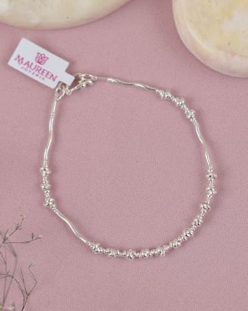 Pulsera tubo ondeado y chaquira con 17 donas tipo nudo - Plata