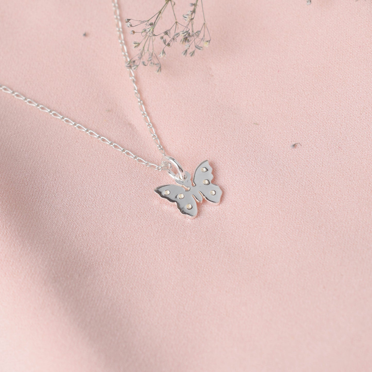 Dije mariposa con 6 puntos