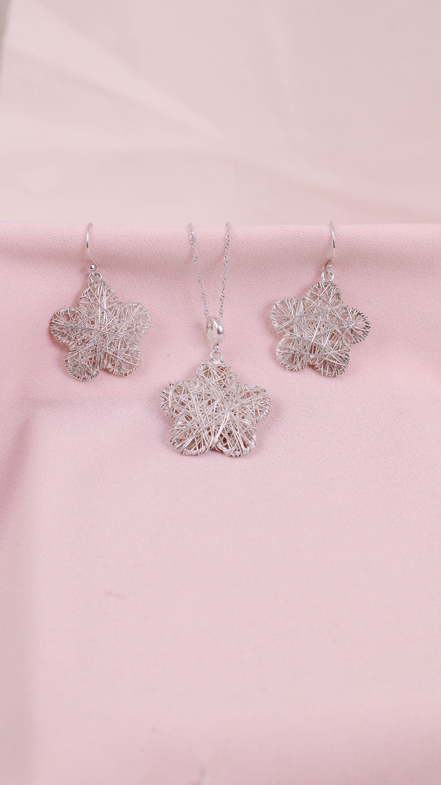 Juego estrella tejida colgante- Plata