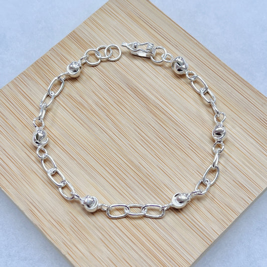 Pulsera donas entrelazadas y eslabones - plata