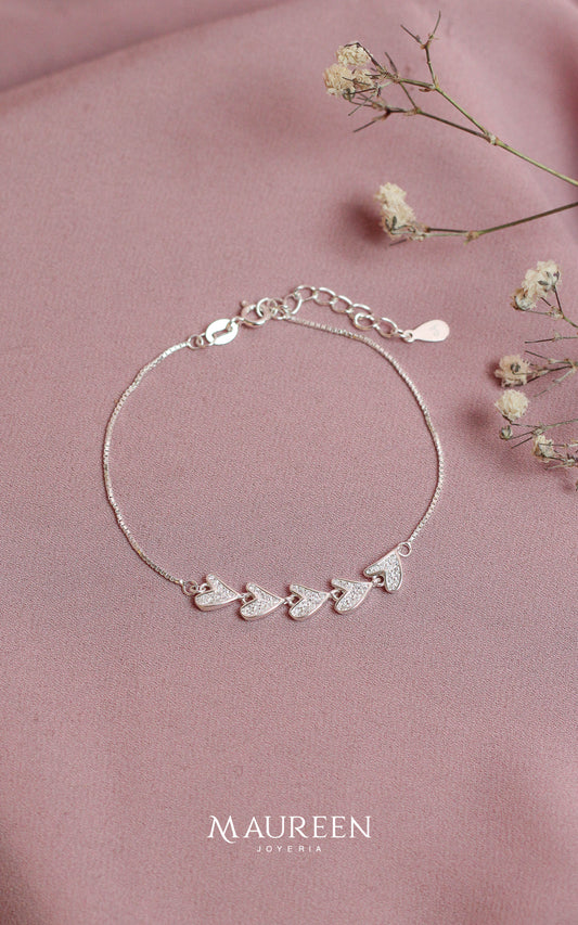 Pulsera corazones ladeados circones - Plata