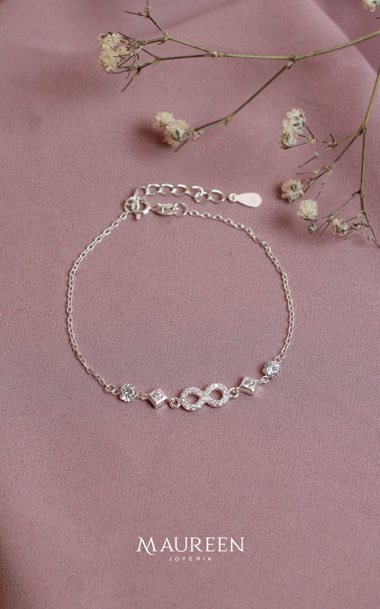 Pulsera infinitos romos punto luz - Plata