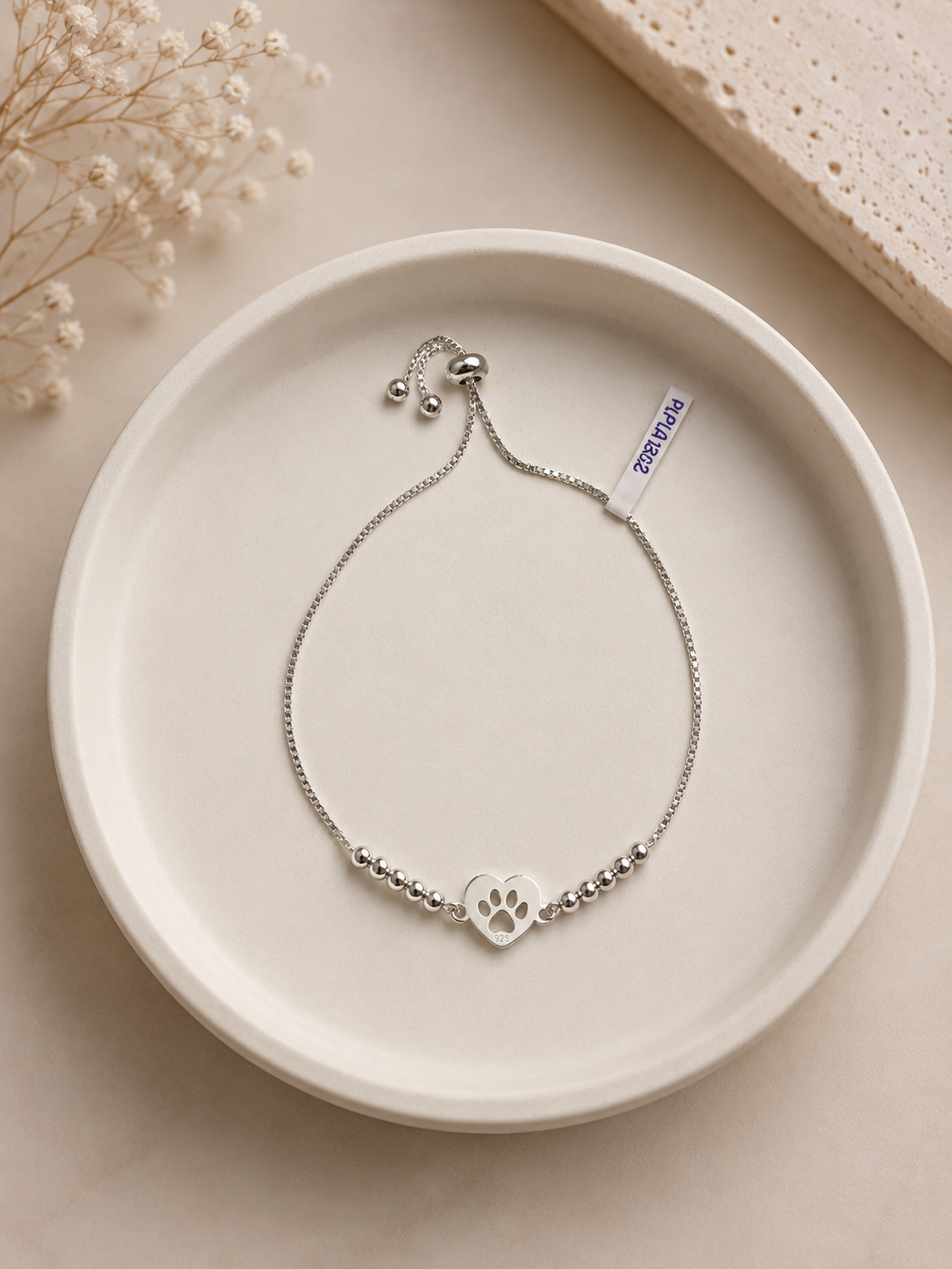 Pulsera ajustable con esferas y huellita - Plata