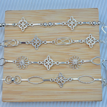Pulseras delgadas nudo de bruja - plata