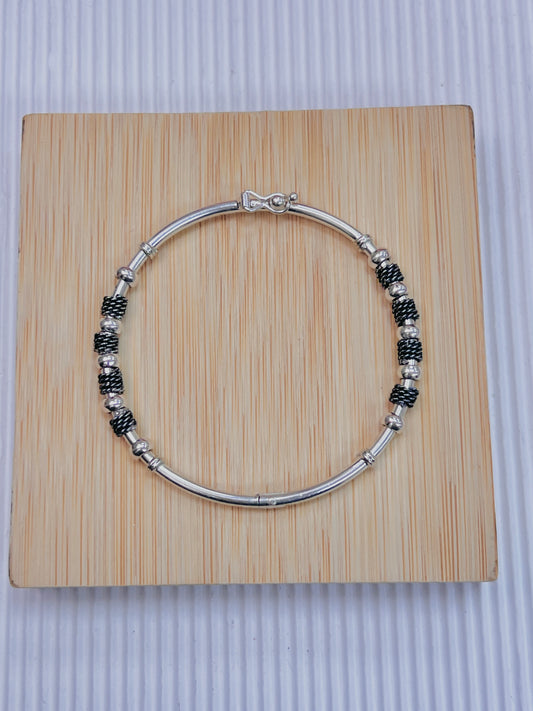 Puñera donas y entrelazado - plata quemada