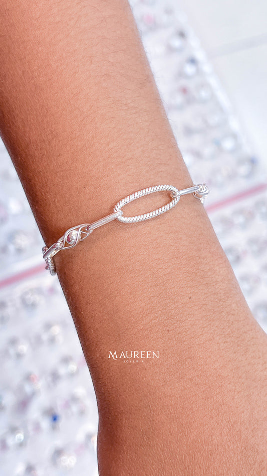 Pulsera argollas oval enroscada y esfera prisionera - plata