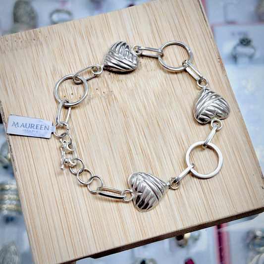 Pulsera corazones y argollas - plata