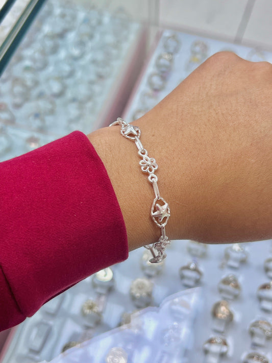 Pulsera estrellas y flor calada - plata