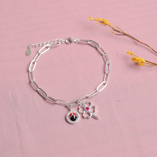 Pulsera cadena dije mariquita y flor - Plata
