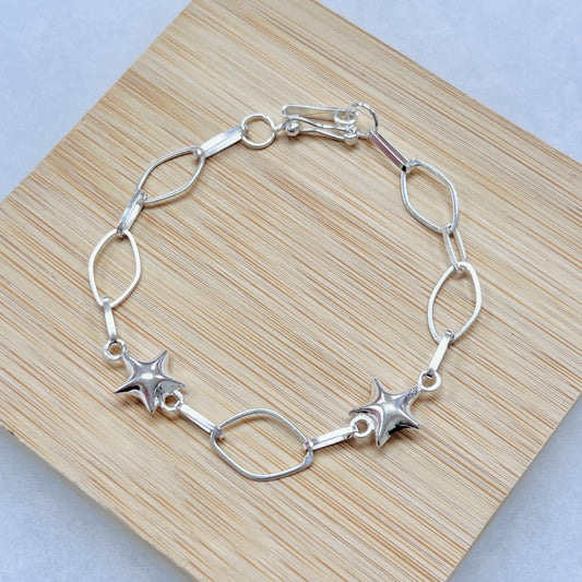 Pulsera estrellas bombachas con rombos calados - plata
