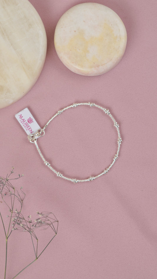 Pulsera chaquira con 12 donas tipo nudo -  Plata