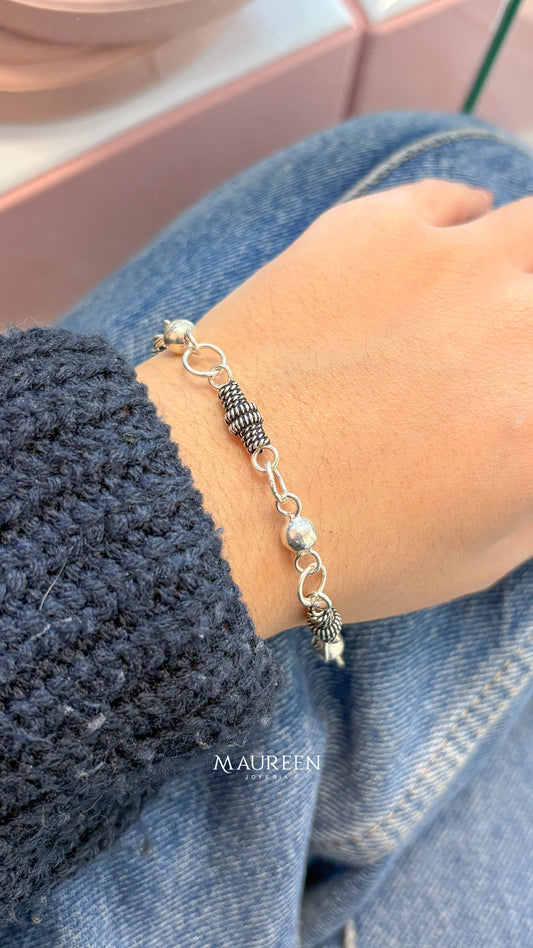 Pulsera esferas con entorchados - plata quemada