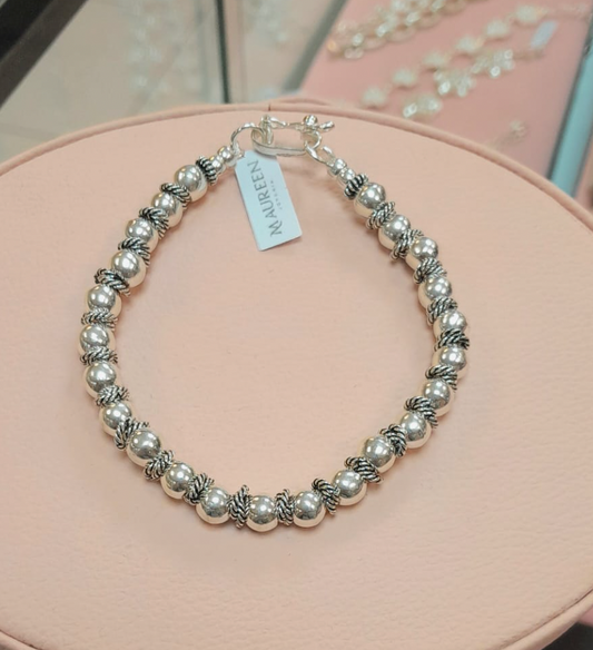 Pulsera rigida esferas medianas con donas entorchadas  - Plata quemada
