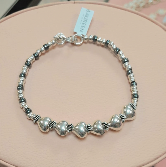 Pulsera rigida 6 corazones bombachos y donas pequeñas - Plata quemada
