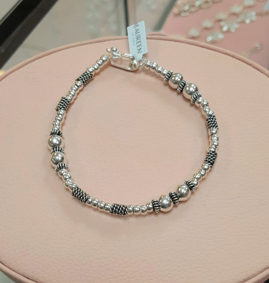 Pulsera rigida dos esferas con donas lisas y entorchadas - Plata quemada